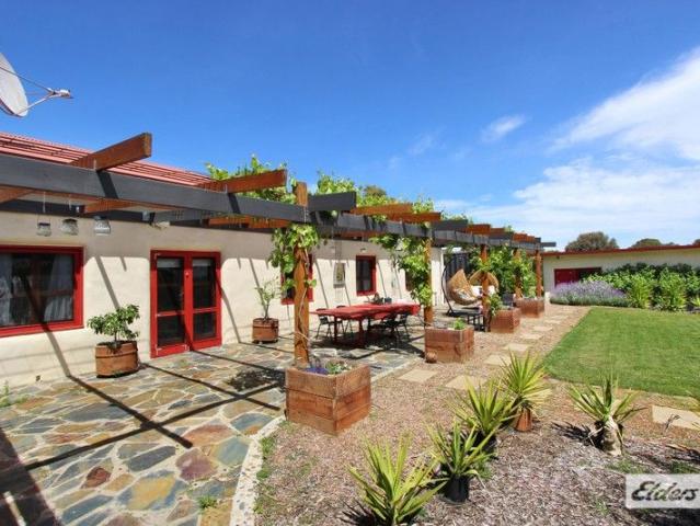 SUSTAINABLE, ECO FRIENDLY & ENERGY EFFICIENT STRAW BALE HOME ON 19.6 ACRES