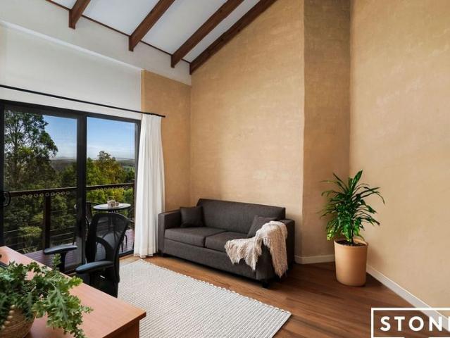 Unique mud brick sanctuary with panoramic valley & ocean views