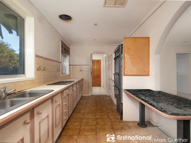 Unleash the Potential of This 3 Bedroom Brick Home