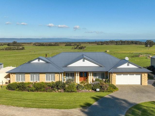 Unparalleled Acreage Living with Water Views and Income or Multi Generational Living Potential
