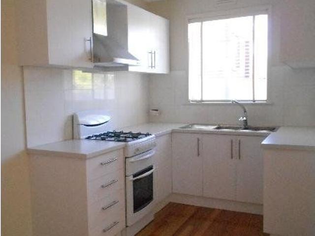 Updated One Bedroom Villa Unit with Private Courtyard in Prime Coburg Location