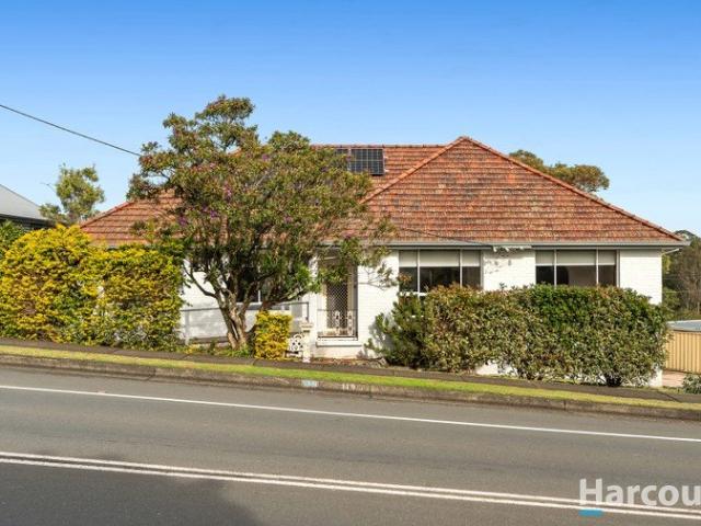 Updated and spacious with a big backyard and plenty of garaging