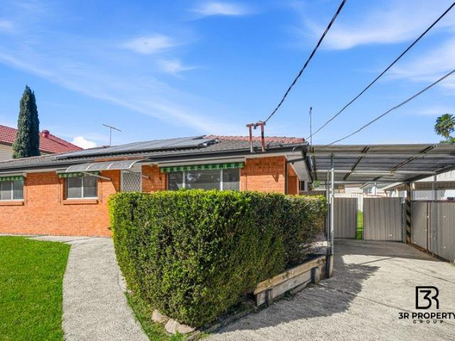 UPDATED BRICK HOME ON A HUGE, RARE PARCEL OF LAND!