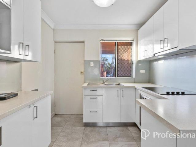 UPDATED GROUND FLOOR APARTMENT WITH EASY CARE APPEAL