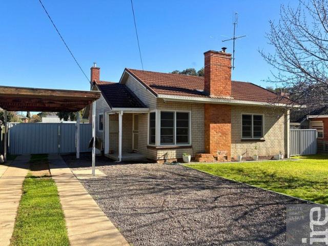 Updated Two Bedroom Home with Modern Finishes & Outdoor Entertaining Area!