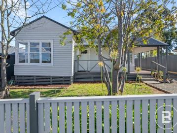 UPDATED THREE BEDROOM HOME WITH PERMIT FOR TWO LOT SUBDIVISION