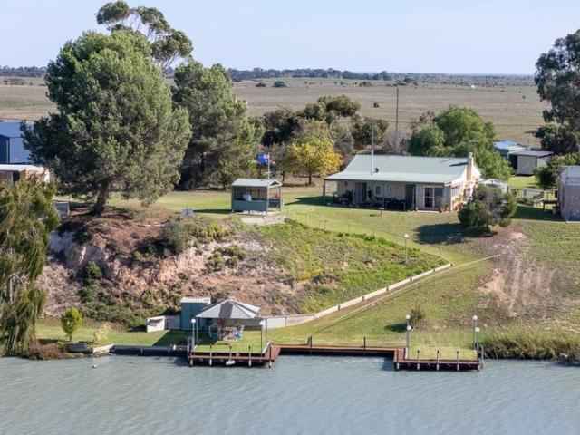 Upgraded Riverfront Living with Freehold to the Water's Edge