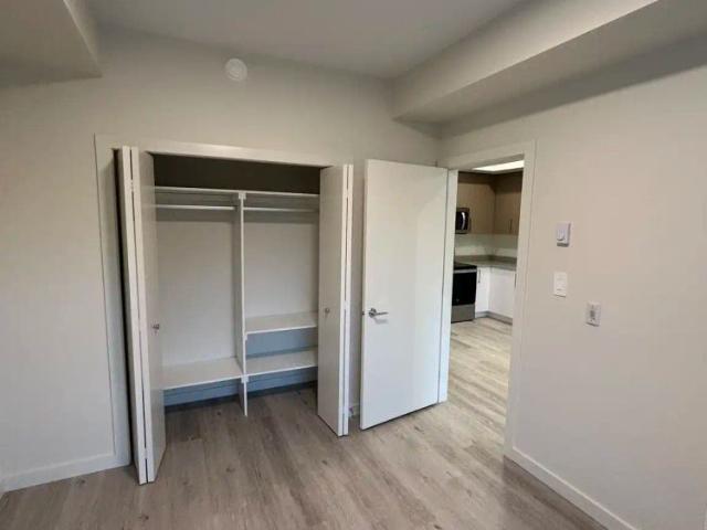Uptown Residences Building A — 1BR + DEN