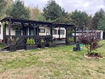 Urokliwa działka z domkiem holenderskim i garażem 35 m²