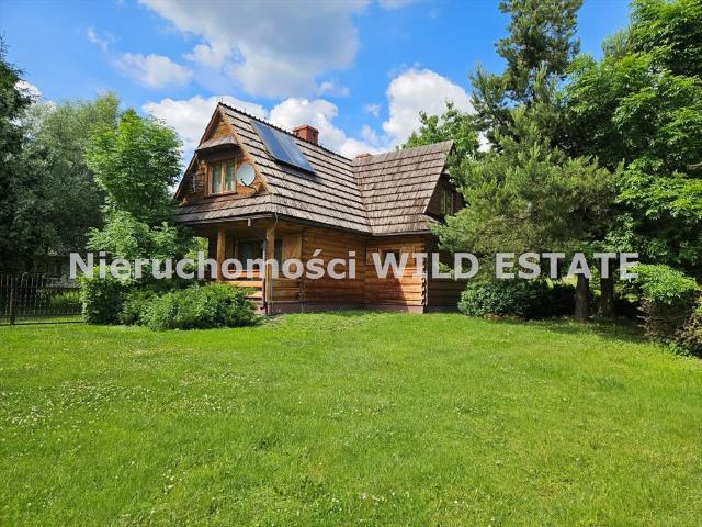 Urokliwy dom drewniany 124m² z ogrodem w Łodynie