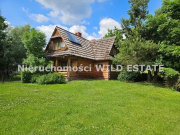 Urokliwy dom drewniany 124m² z ogrodem w Łodynie