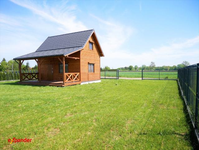 Urokliwy dom drewniany 70 m2 z garażem i ogrodem