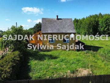 Urokliwy dom z dużą działką i potencjałem inwestycyjnym