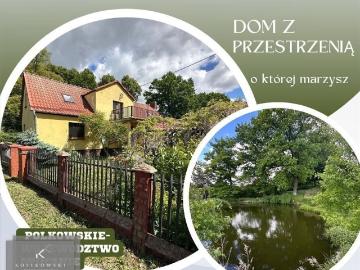 Urokliwy dom z dużą działką, stawem i budynkami gospodarczymi
