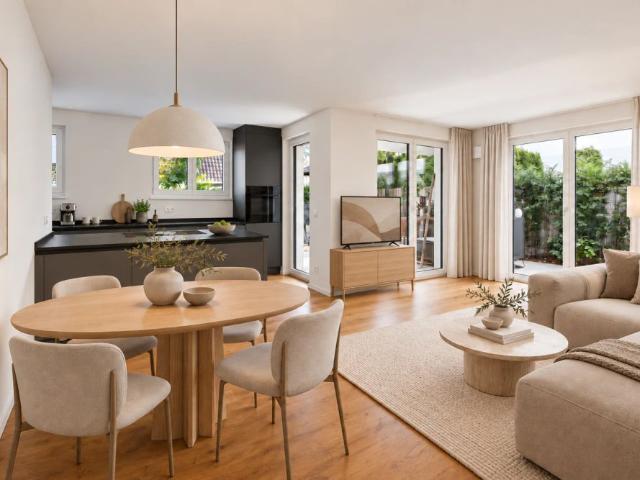 Urban wohnen, im Grünen aufleben – moderne Erdgeschosswohnung mit Garten