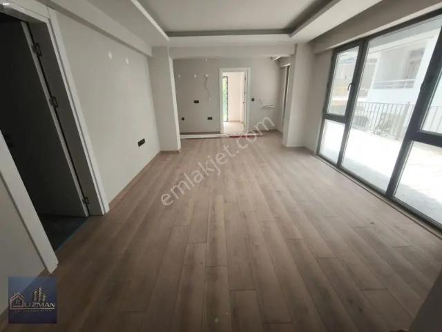 Uzman Emlak'tan 1+1 Bahçe Katı Sıfır Satılık Daire