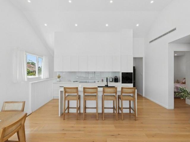 Vast near new duplex poised on coveted address