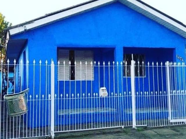 Venda de terreno com 2 casas