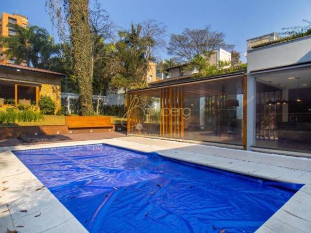 VENDA PORTEIRA FECHADA CASA com 1200m² terreno, 4 suítes, área gourmet, piscina, 8 vagas
