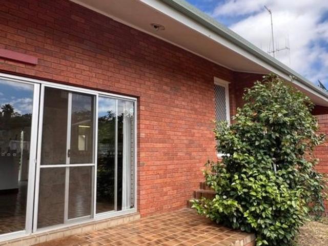 VERY CONVENIENT UNIT WITH OWN YARD
