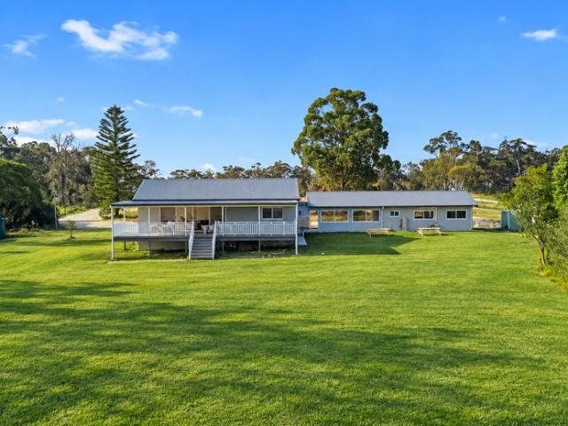 Versatile Acreage Living in an Exclusive Gated Estate
