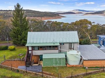 Versatile Lakeside Living with Income Potential