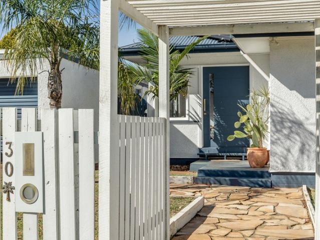 Vibrant and Versatile in a Desirable Rangeville Locale