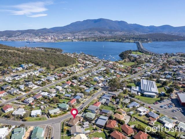 views, broad stylish appeal & perfect central location!