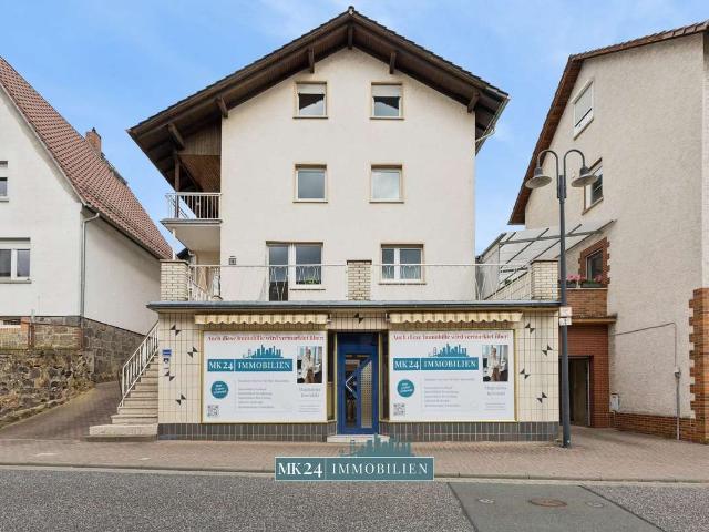 Vielfalt unter einem Dach – Gepflegtes Dreifamilienhaus mit Gewerbeeinheit, Garten & Doppelgarage