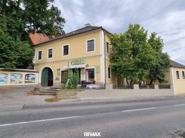 Vielseitige Immobilie mit Pizzeria und Wohnmöglichkeiten