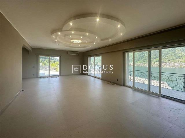 Villa con piscina vista lago e grottino