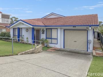Walk to Beaches, Country Club and Town Centre from This Spacious Single Level Home with Tandem Garage Workshop