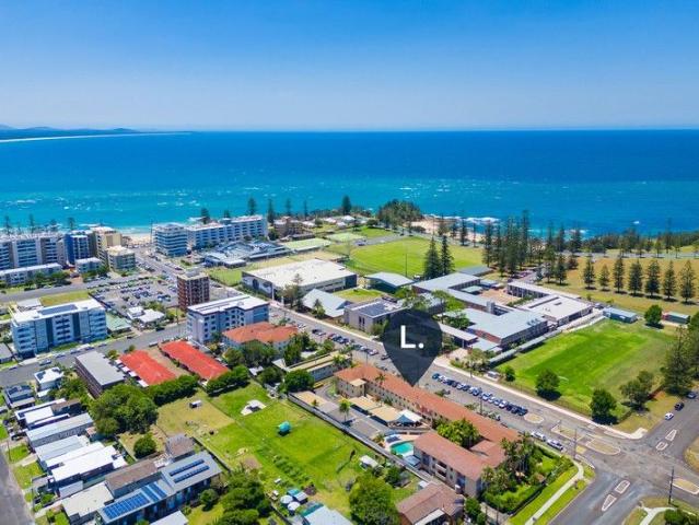 Walk to Town Beach Cozy Coastal Apartment With Attractive Returns