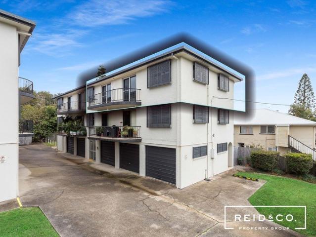 Walk to waterfront. 2 garages plus storage room!