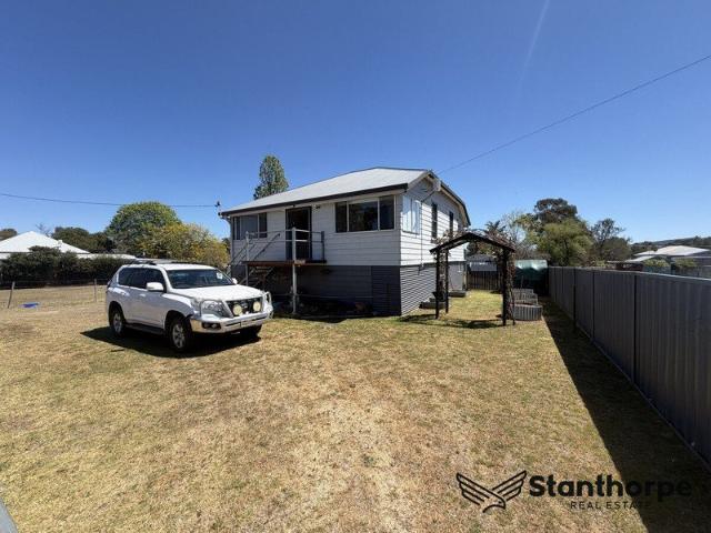 WALLANGARRA ROOM TO MOVE, ROOM TO GROW RENOVATED HIGH SET HOME WITH VIEWS 1/2 ACRE