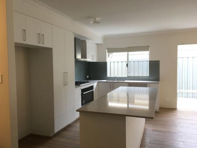 Warm, Spacious & Low Maintenance Living!