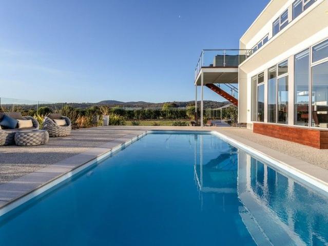 Dual Living Waterfront Magnificence on Pristine Acreage