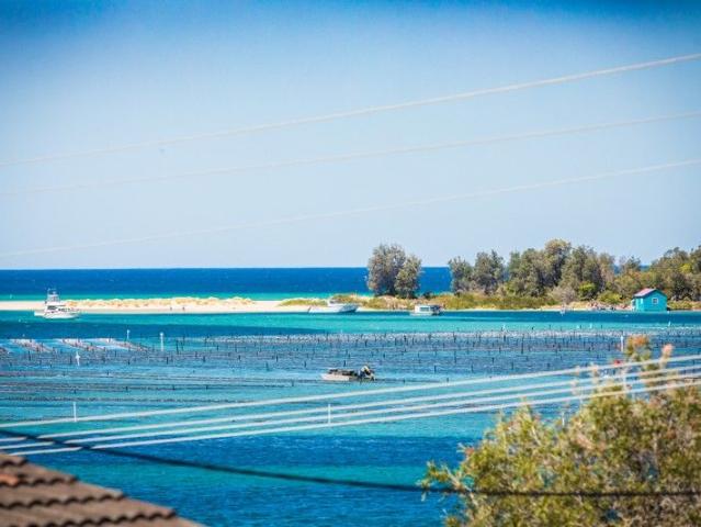 Waterfront Living with Flexible Income Potential