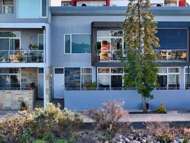 Waterfront Calm Meets Two Level Townhouse Flexibility