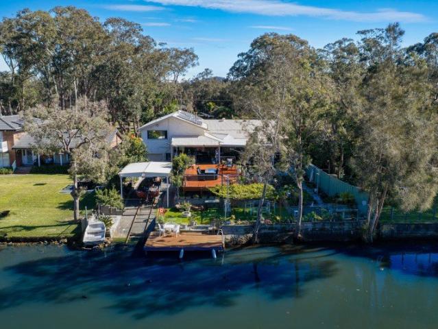 Waterfront Family Living with Multiple Living Areas & Exceptional Space
