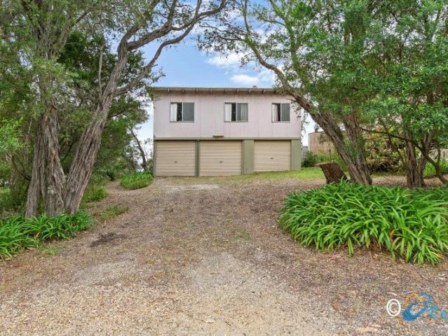 WATERFRONT GEM WITH ENDLESS POTENTIAL A TRUE RENOVATOR'S DELIGHT!