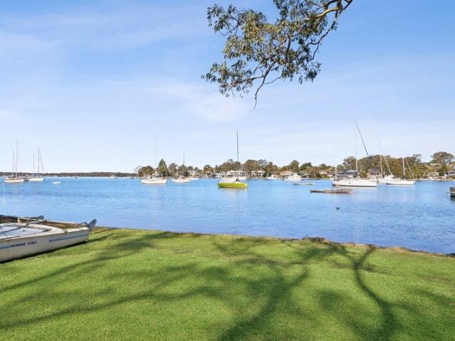 Waterfront home with boat shed