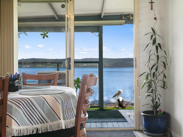 WATERFRONT LIFESTYLE AWAITS RELAXED LIVING BY LAKE ILLAWARRA
