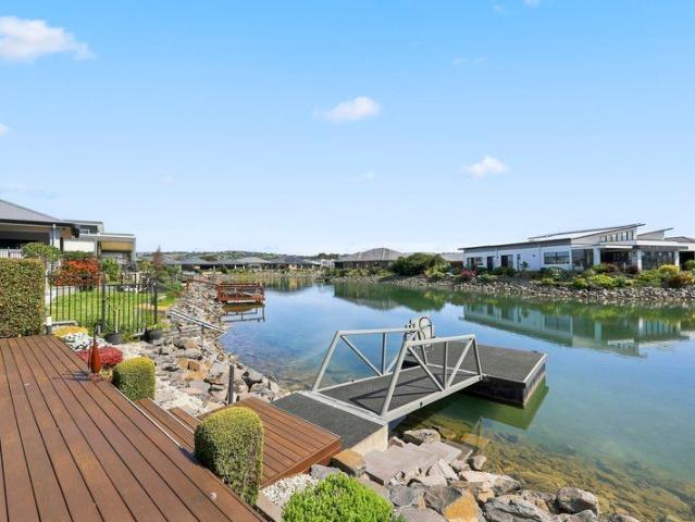 Waterfront Living with Space, Security & Lifestyle Appeal!