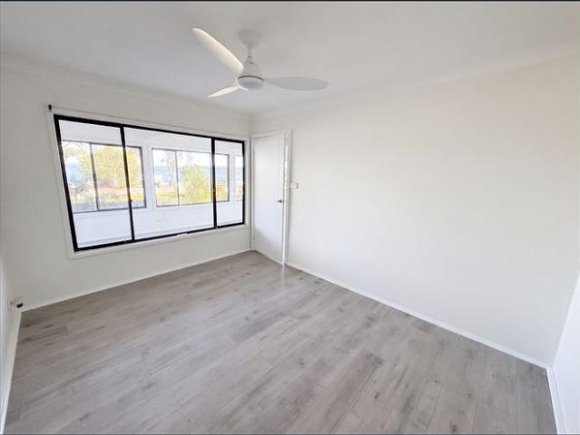Waterfront Three Bedroom Downstairs Residence With Garage