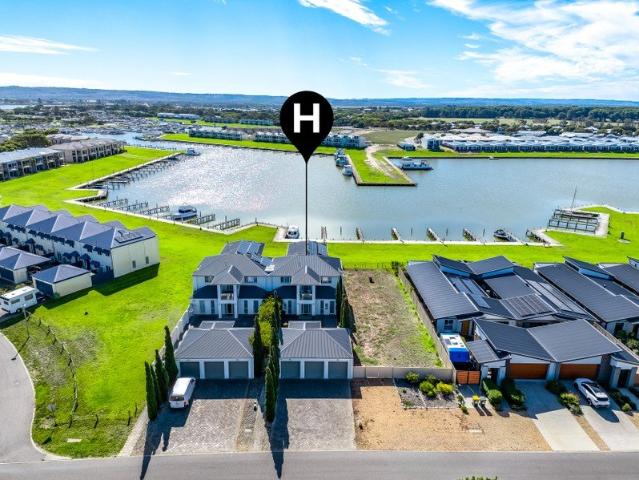 Waterfront Villa with Marina Views & Rare Triple Garaging