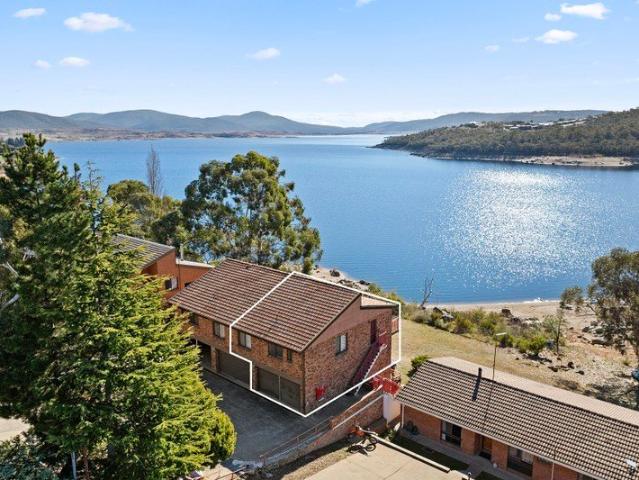 Waterfront with a double garage!