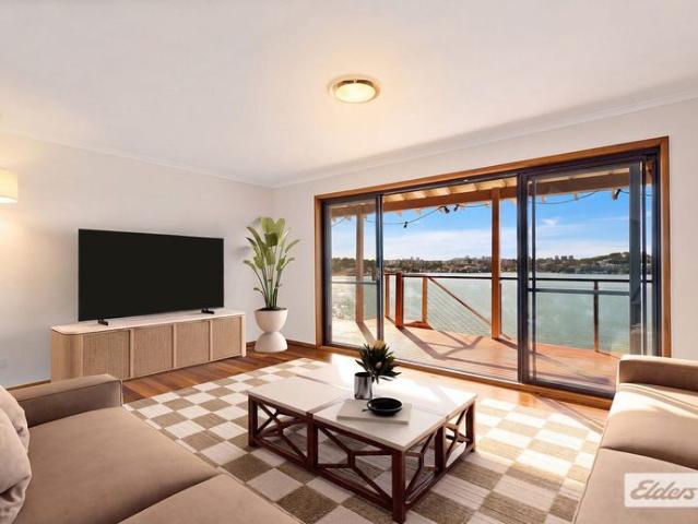 Waterfront with jetty, pontoon, boatshed and slipway