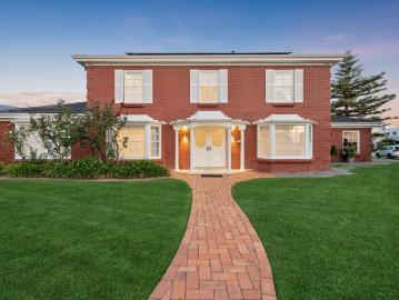 Welcome To Your New Place, a Renovated Solid Brick Colonial Wonder with Direct Lake Access!