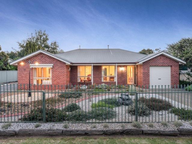 Well Maintained Brick Home with Large Shed Walking Distance to the River